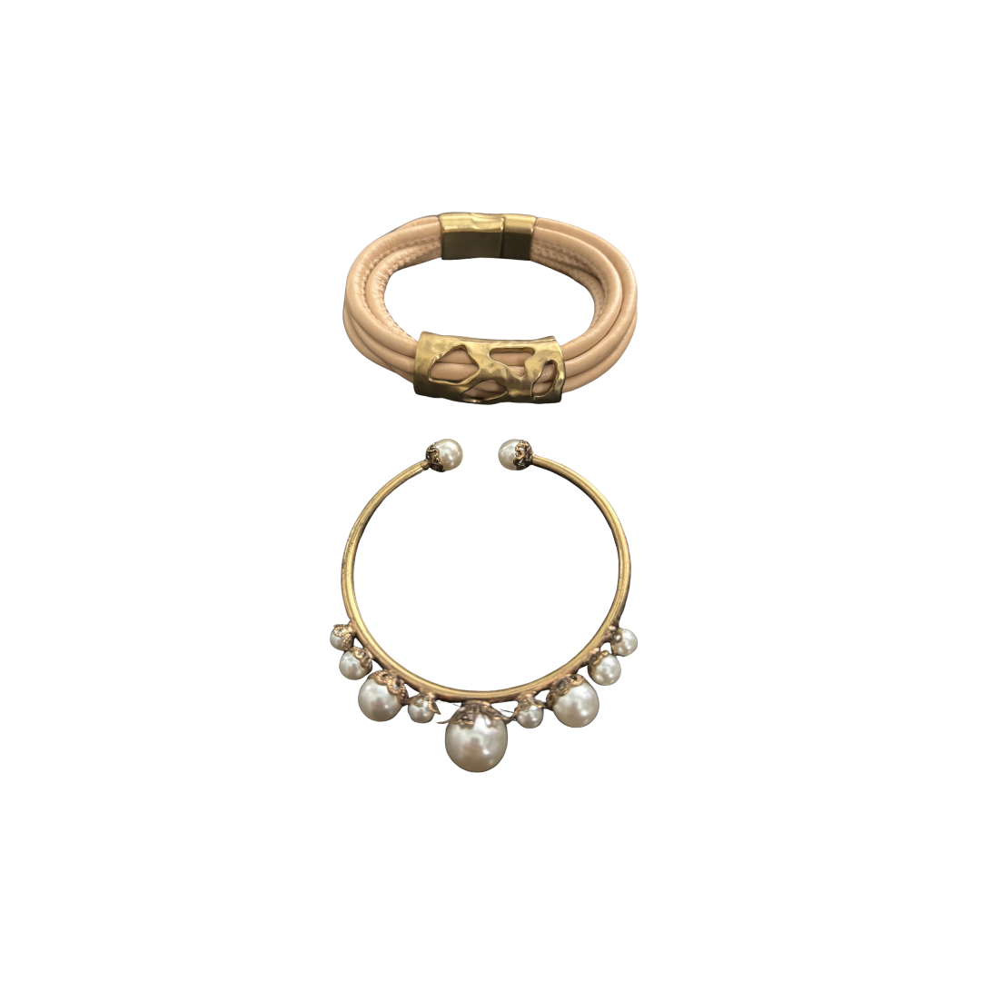 Two gold bracelets with different designs on a white background