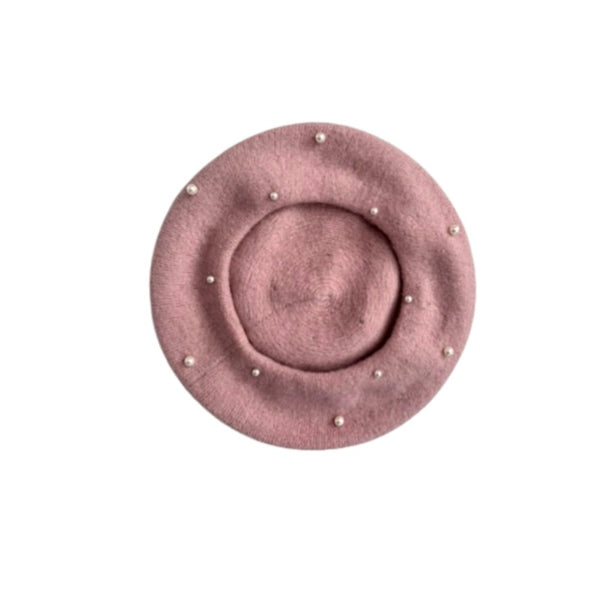 Pink beret with pearl embellishments on a white background