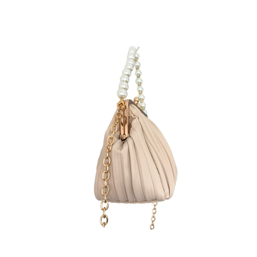 Beige handbag with pearl and chain detail on a white background