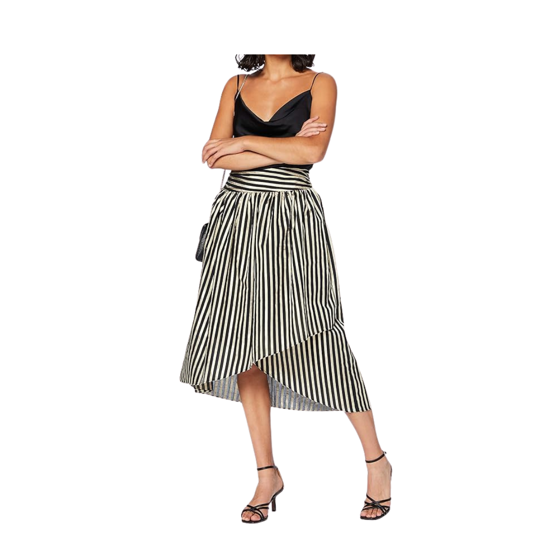 Woman wearing a black and white striped dress on a white background