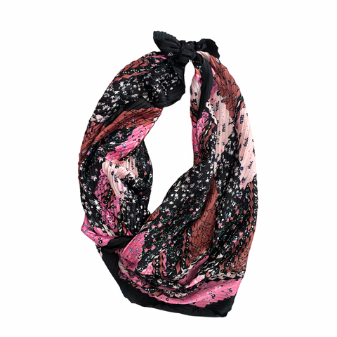 Pink and black pattern tied scarf white background