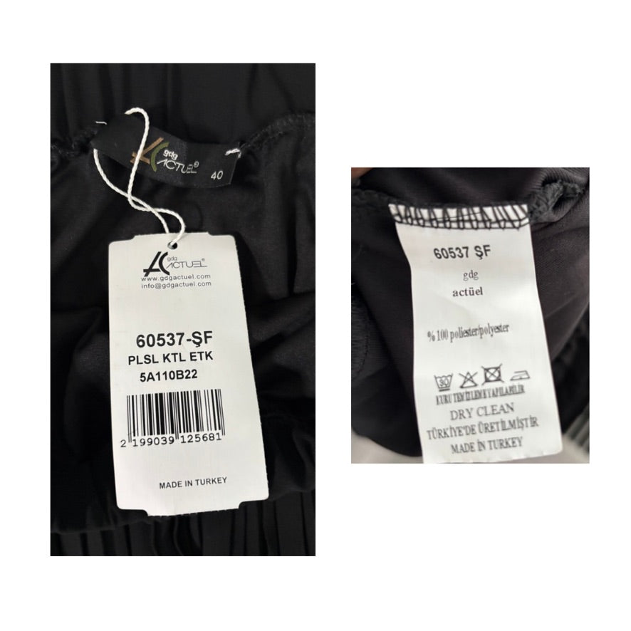 Clothing tag with product details and care instructions on a black garment.