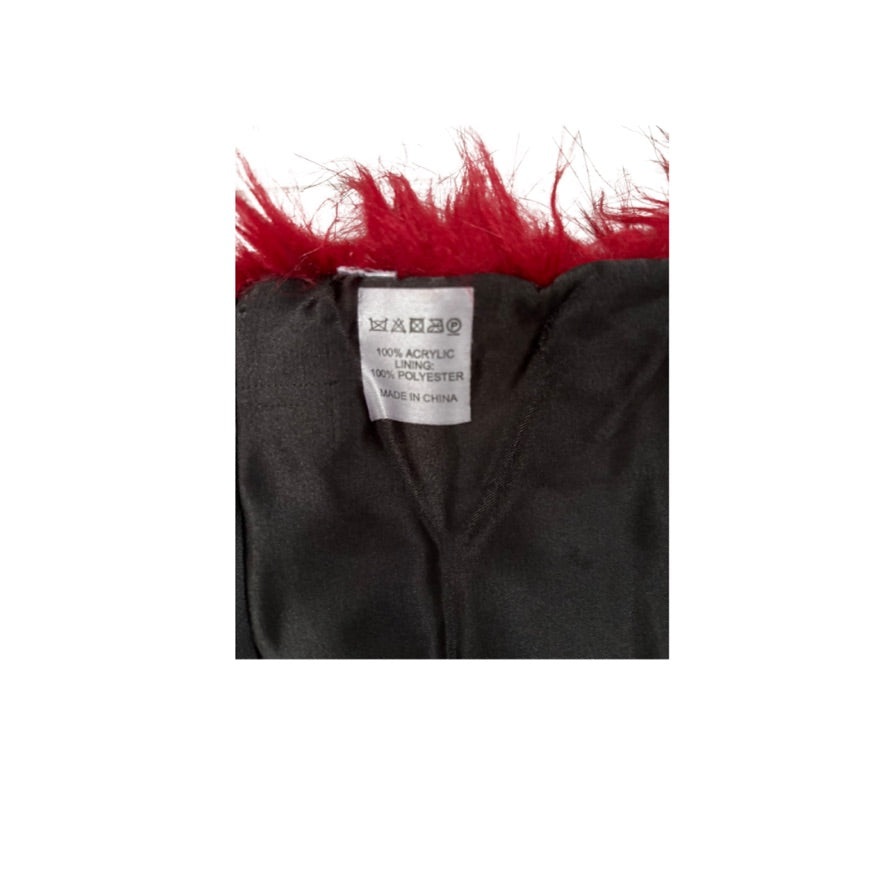 Black garment with red fur trim and a label on a white background