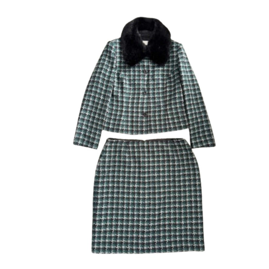 Plaid coat and skirt set with black fur collar on a white background