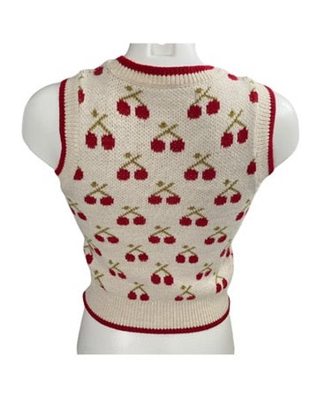 Knitted vest with cherry pattern on a mannequin against a white background