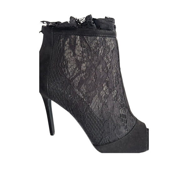 Black lace ankle boot on a white background