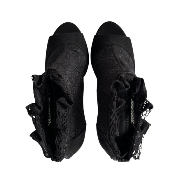 Pair of black lace-up shoes on a white background