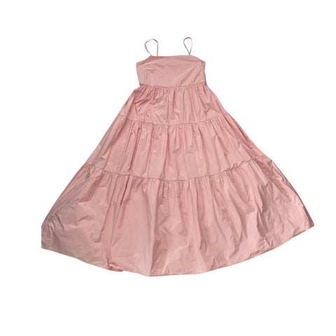 Pink tiered dress on a white background