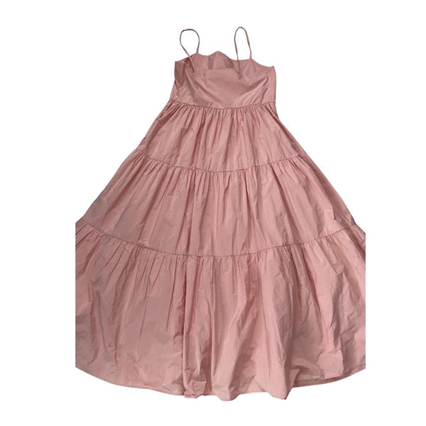 Pink tiered dress on a white background