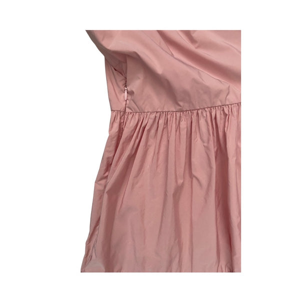 Close-up of a pink dress with a white background