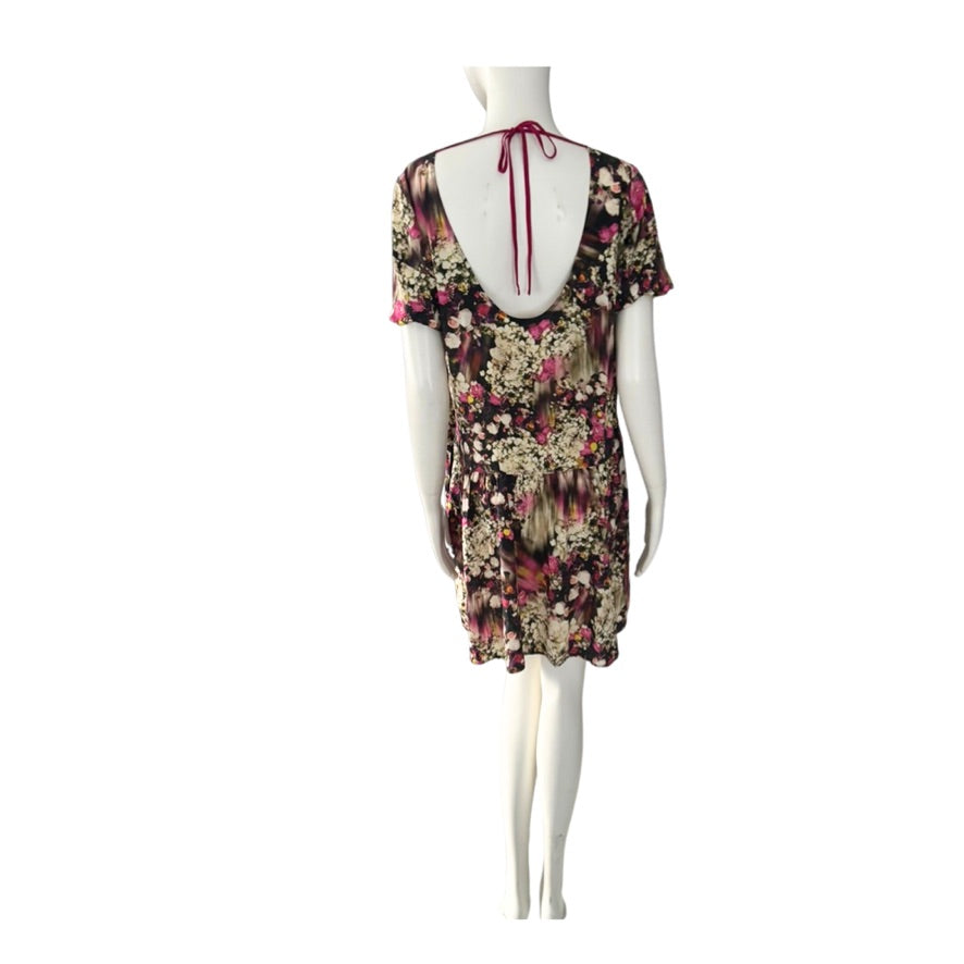 Floral dress on a mannequin against a white background