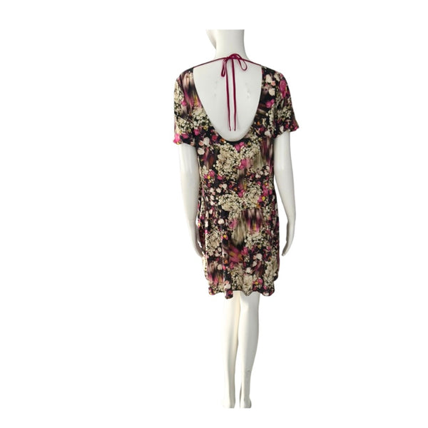 Floral dress on a mannequin against a white background