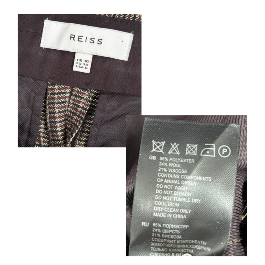Reiss label on a garment with care instructions and material information.