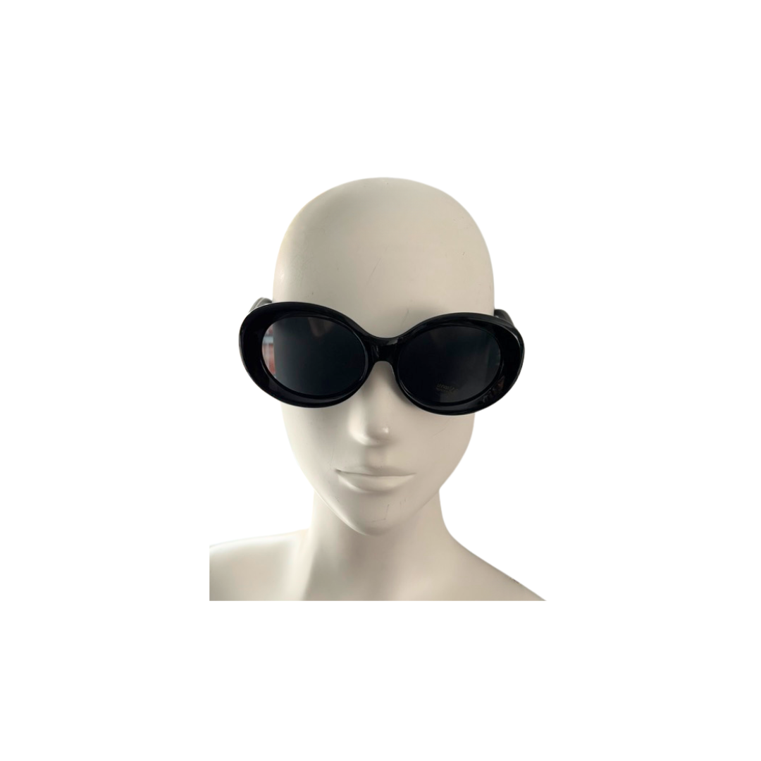 Black sunglasses on a mannequin head against a white background