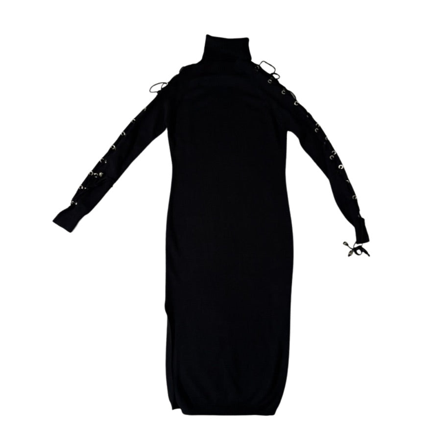 Black dress with long sleeves and lace-up details on a white background