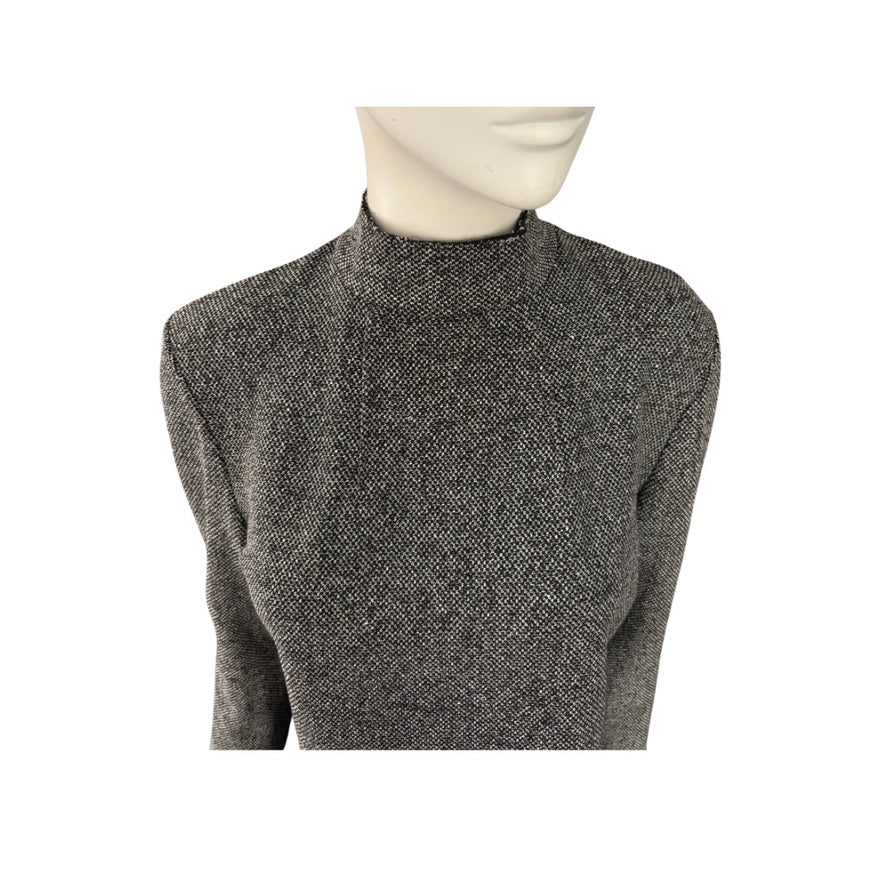 Grey textured sweater on a mannequin against a white background