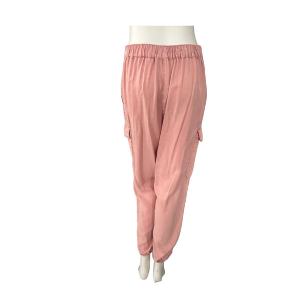 Pink pants on a mannequin against a white background
