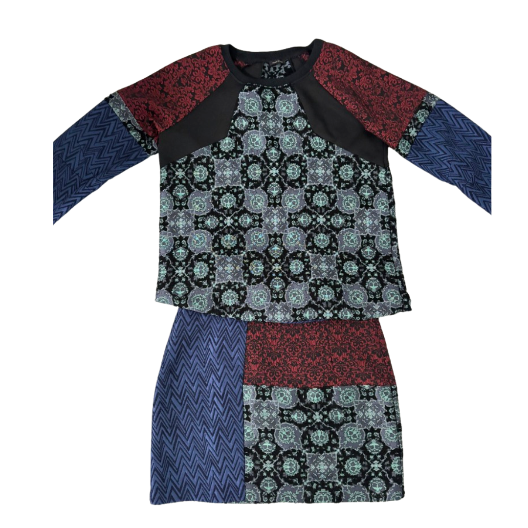 Multicolored patterned dress with long sleeves on a white background