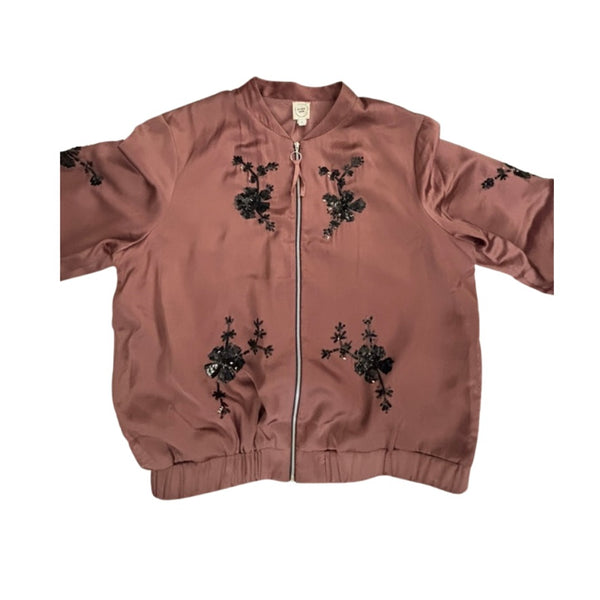 Pink jacket with black floral embroidery on a white background