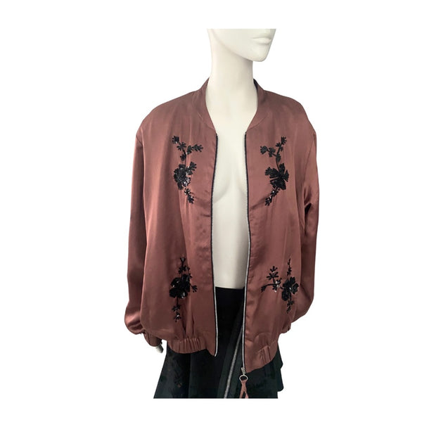 Brown jacket with black floral embroidery on a mannequin against a white background