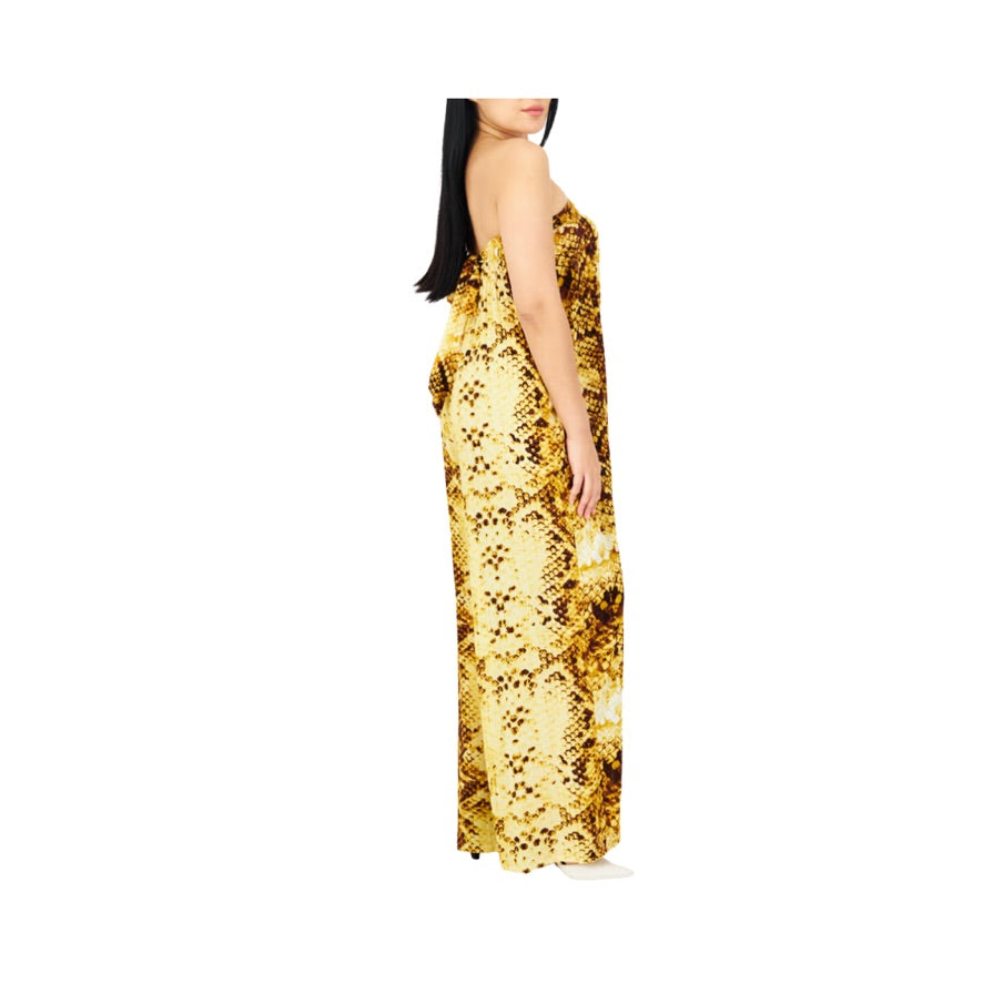Woman wearing a gold sequin dress on a white background