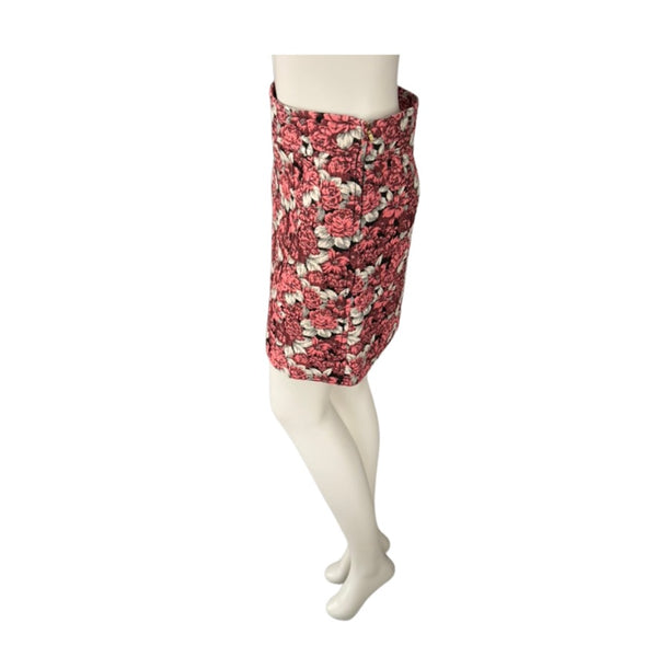 Coral floral skirt on a mannequin against a white background