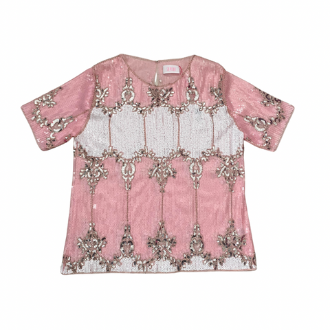 Pink top with silver embroidery on a white background