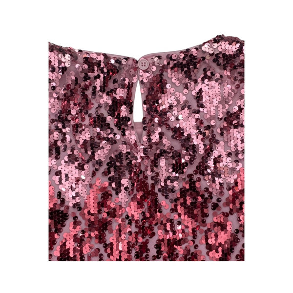 Pink sequin fabric on a white background