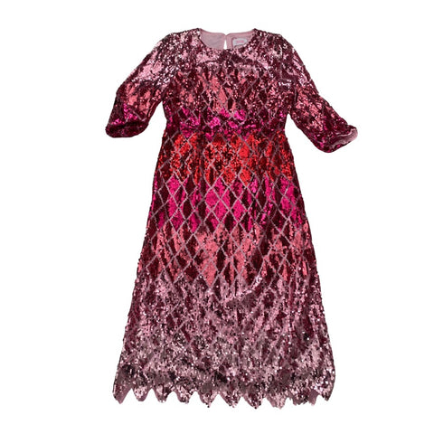 Pink sequin dress on a white background