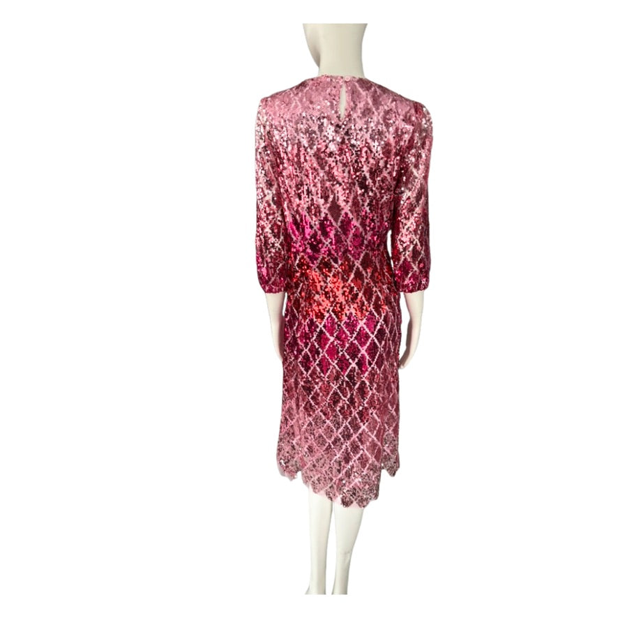 Mannequin wearing a pink sequin dress on a white background