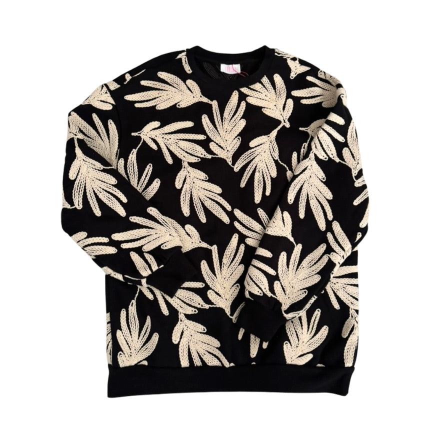 Black sweatshirt with beige leaf pattern on a white background