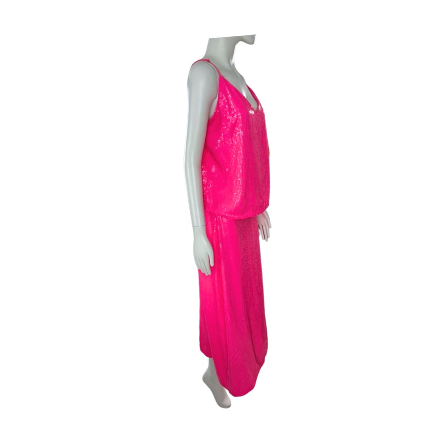 Mannequin wearing a bright pink outfit on a white background