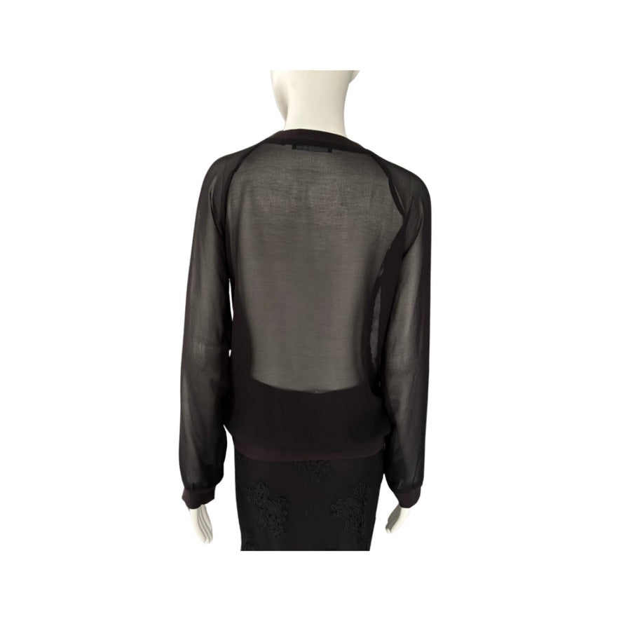 Black sheer blouse on a mannequin against a white background