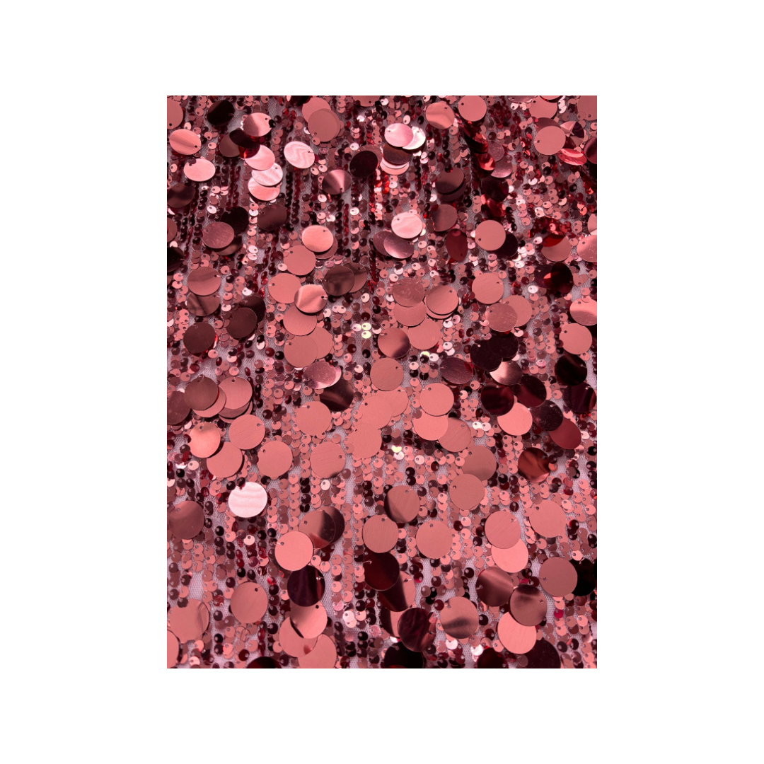 Pink sequin pattern on a white background