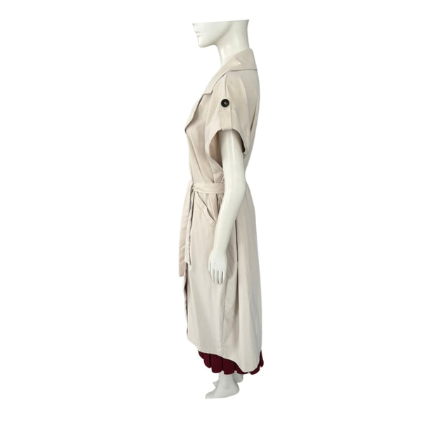 Mannequin wearing a beige dress with a white background