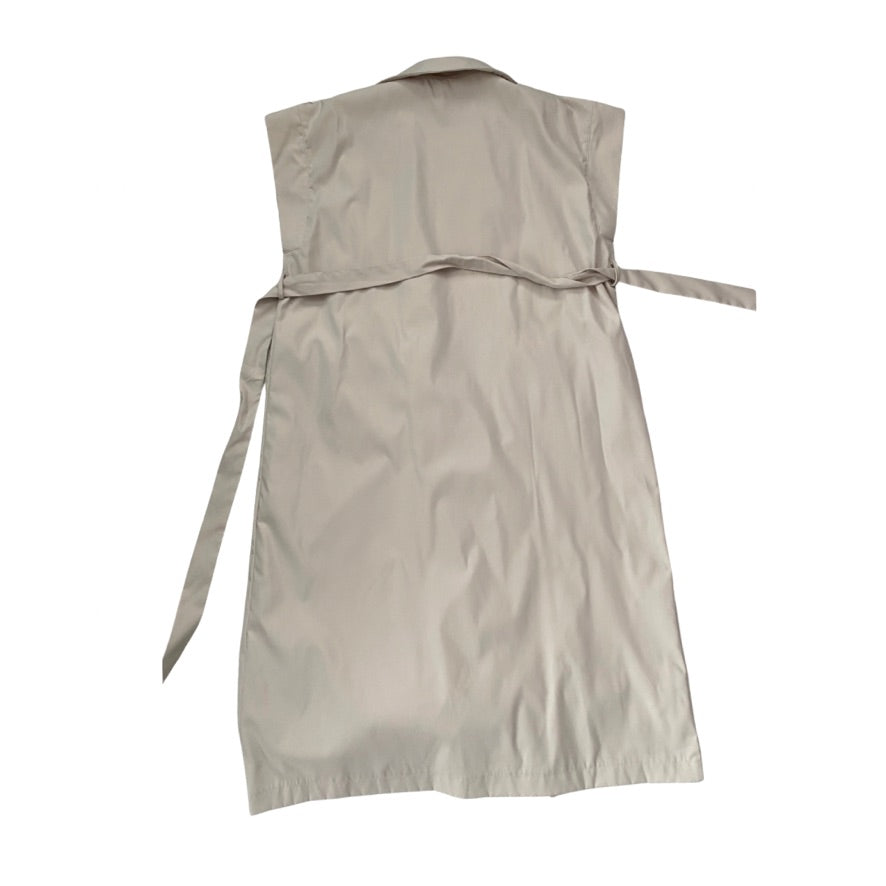 Beige sleeveless dress with a belt on a white background