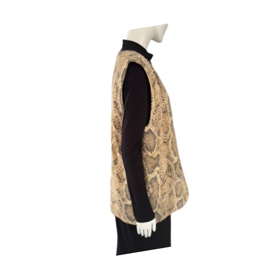 Mannequin wearing a black outfit with a beige patterned vest on a white background
