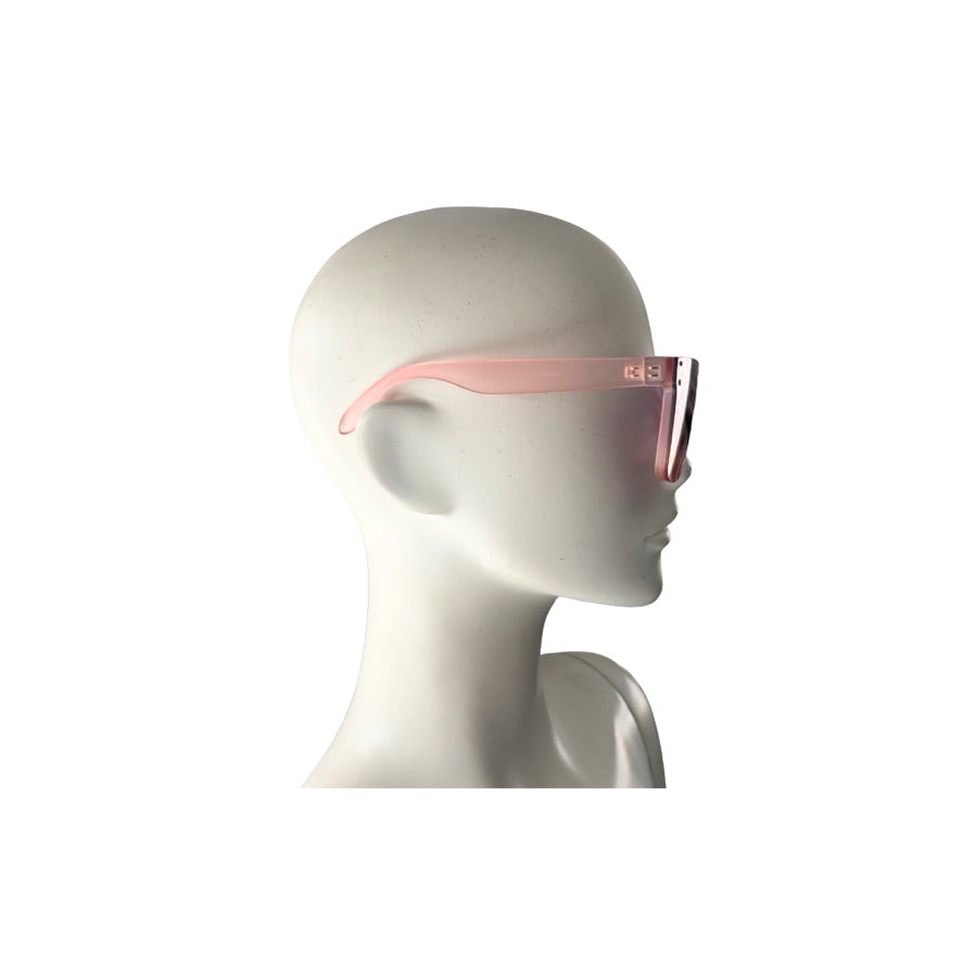 Mannequin head wearing a pair of sunglasses with pink frames on a white background
