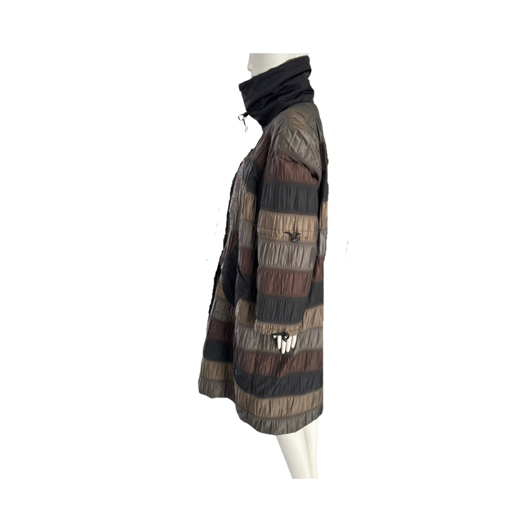 Mannequin wearing a patchwork quilted jacket on a white background