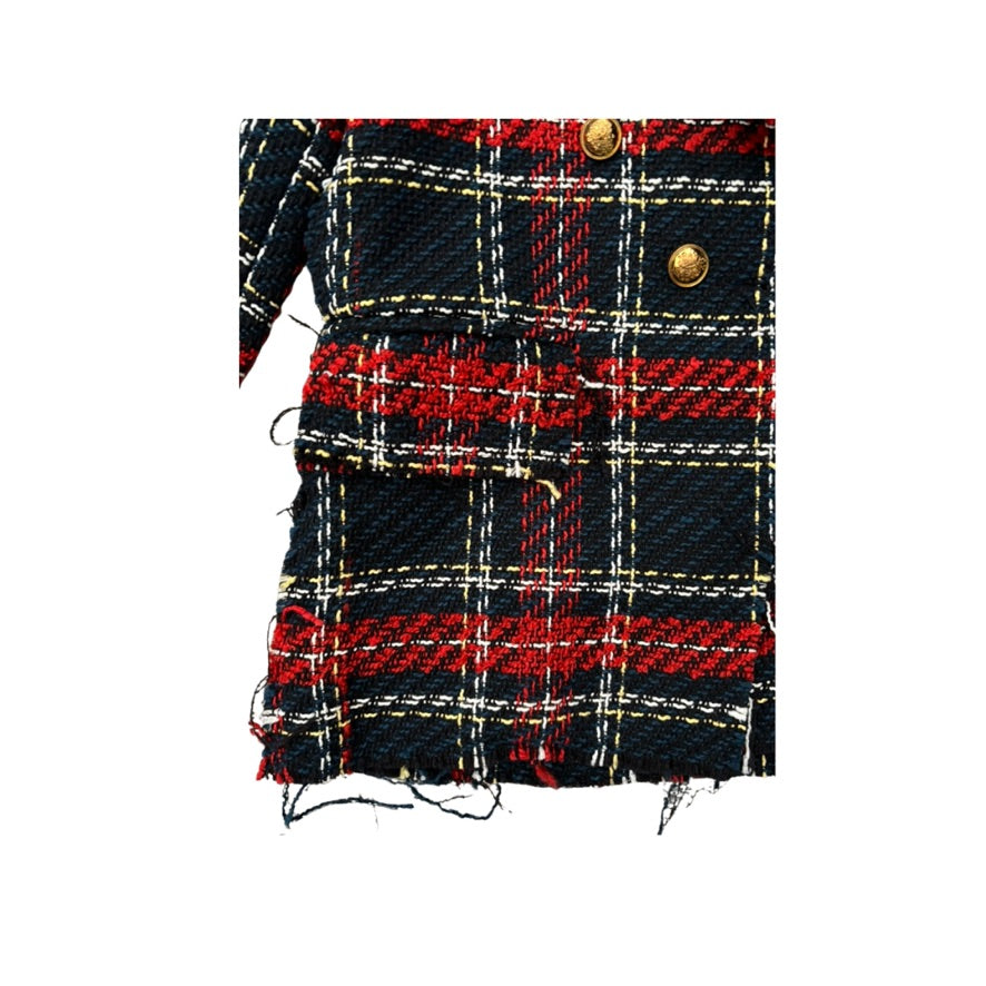 Plaid fabric with red, black, and gold pattern on a white background