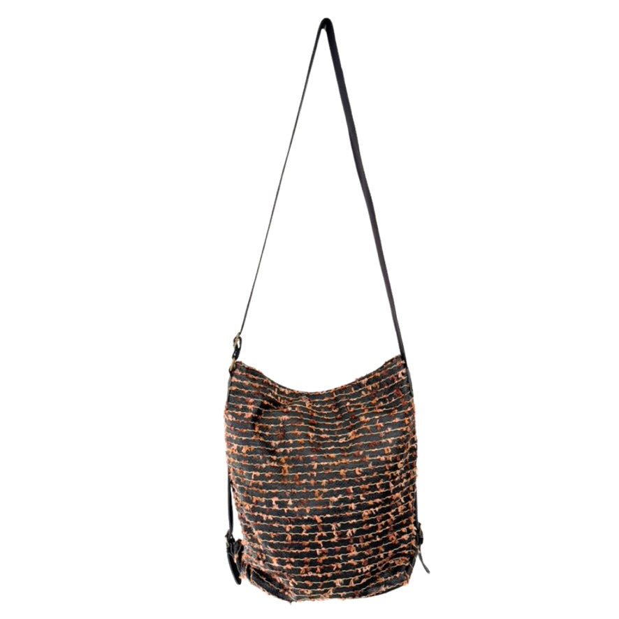 Textured handbag with a strap on a white background