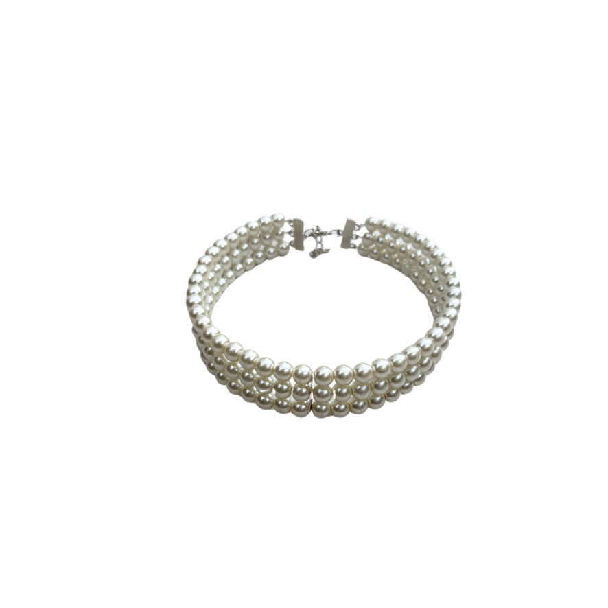 Multi-layered pearl bracelet on a white background