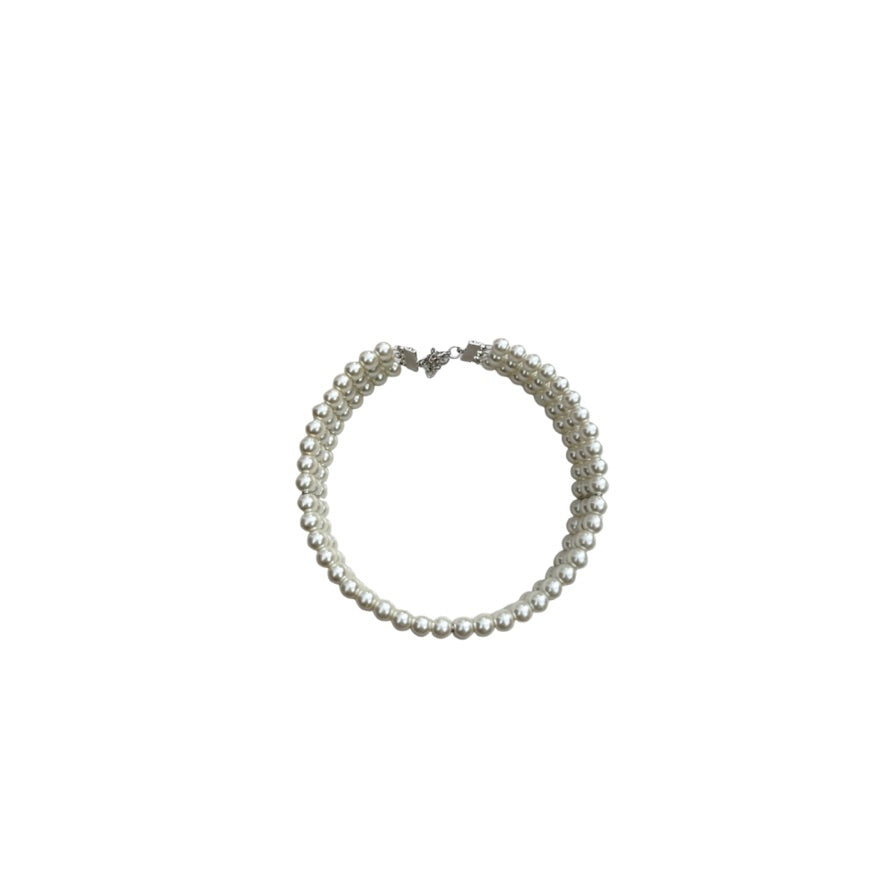 Pearl necklace on a white background