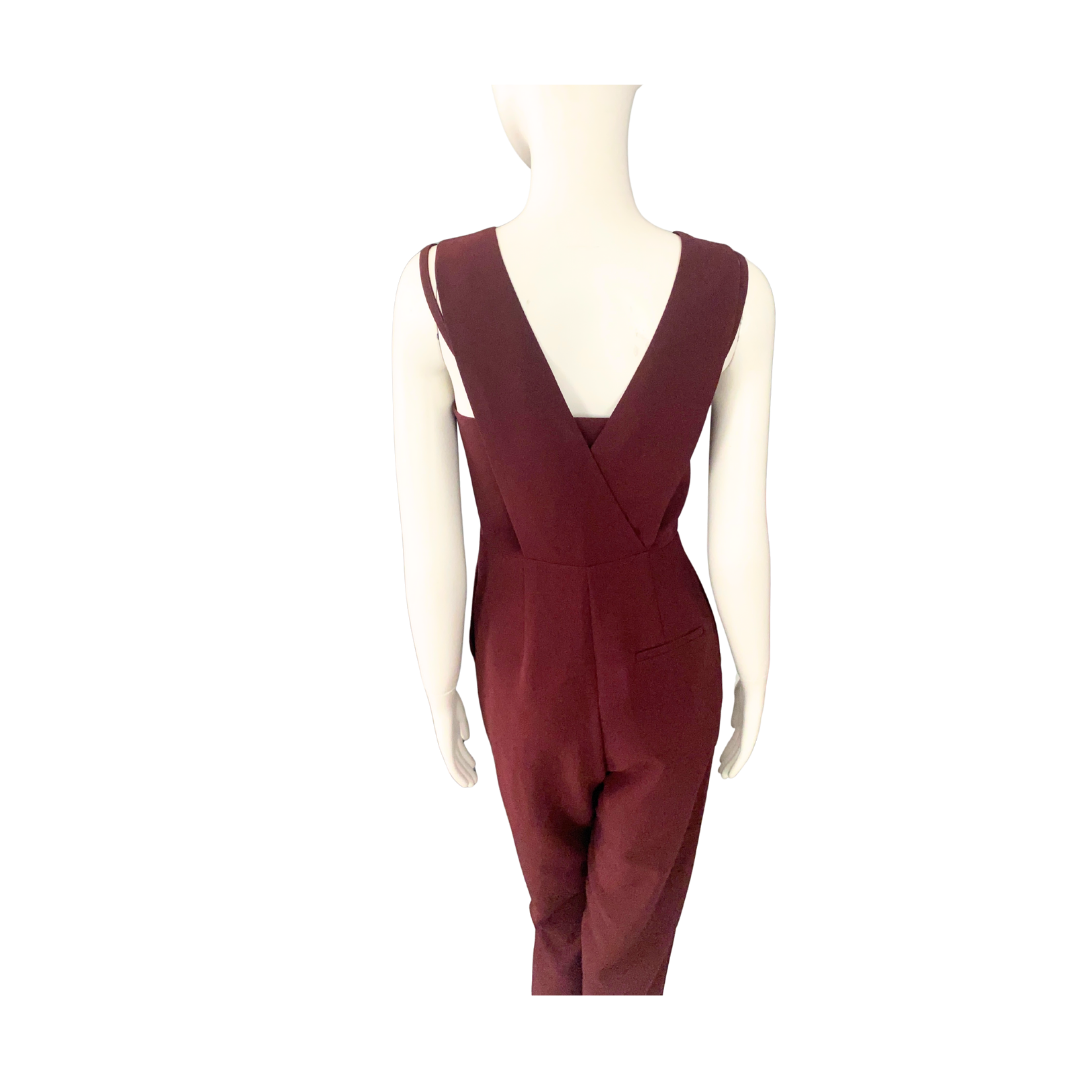 Maroon jumpsuit on a mannequin against a white background