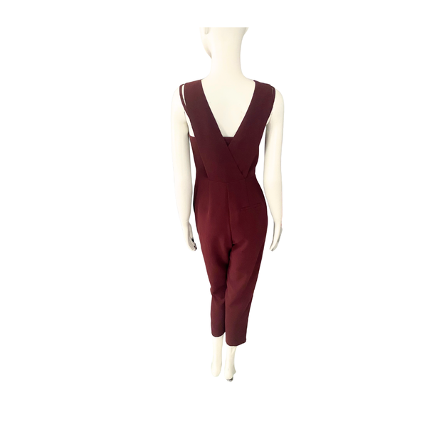 Maroon jumpsuit on a mannequin against a white background