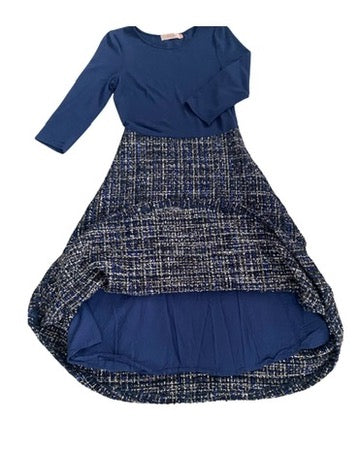 Two-tone dress with blue top and patterned skirt on a white background