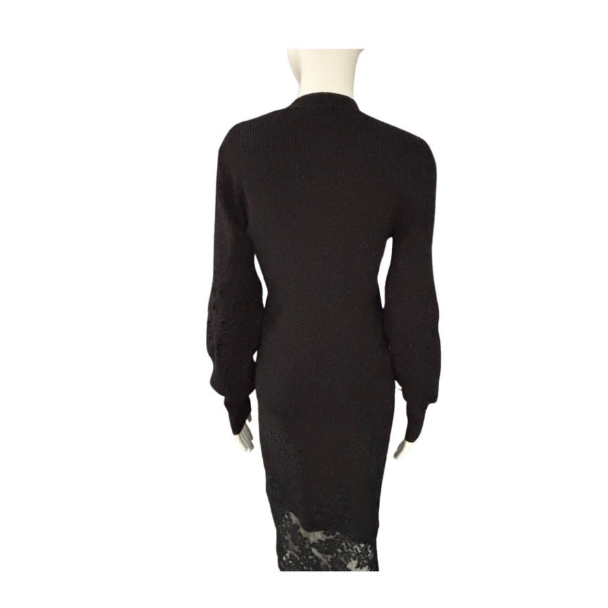 Black dress with lace detailing on a white background