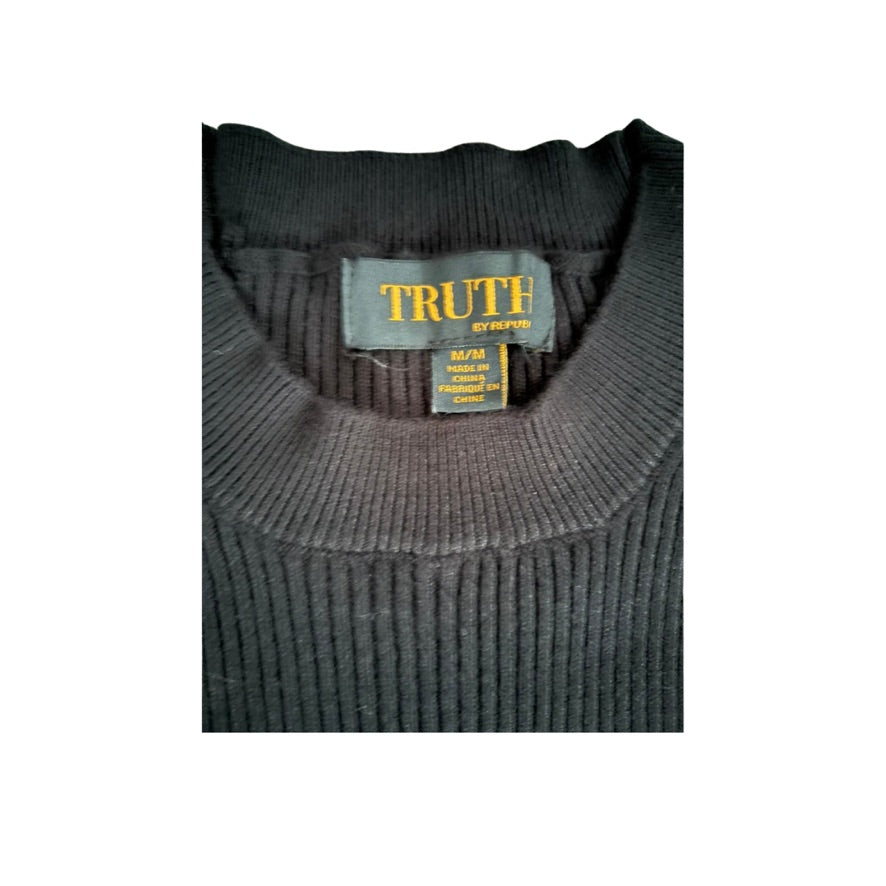 Dark gray sweater with a 'Truth' label on a white background