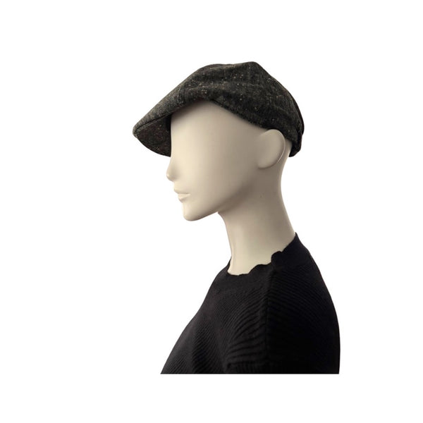 Mannequin head wearing a grey flat cap on a white background