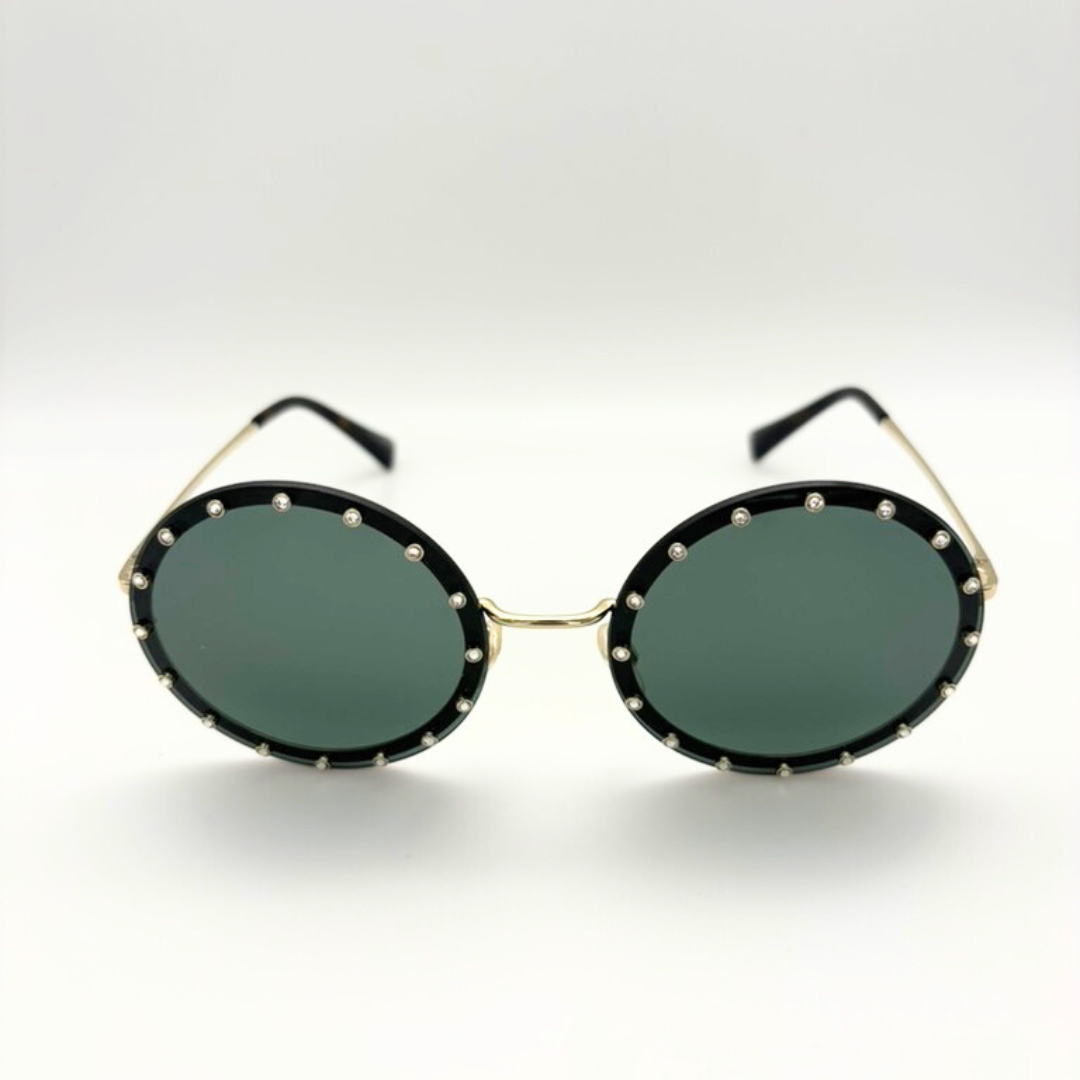 Round sunglasses with black frames and green lenses on a white background